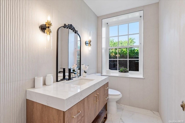 bathroom with vanity and toilet