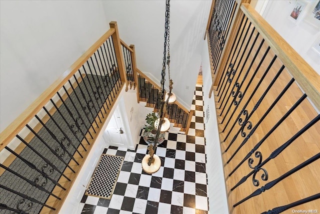 staircase with a towering ceiling