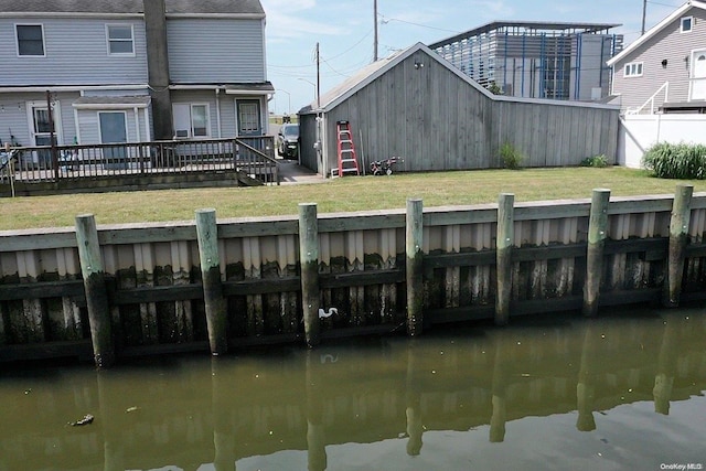 dock area with a wooden deck and a yard