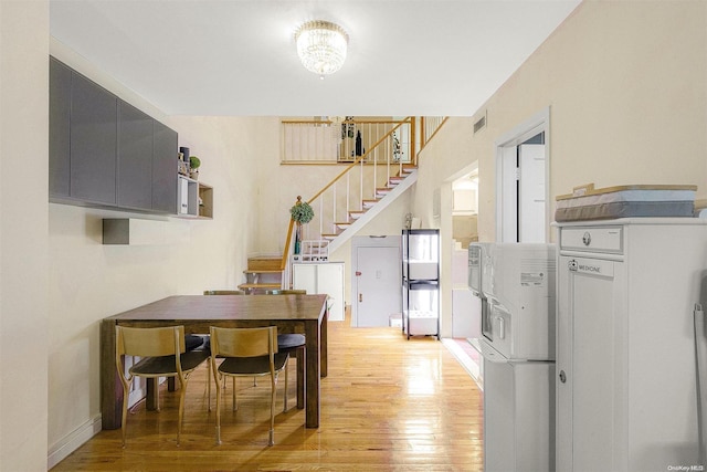 dining room with light hardwood / wood-style floors