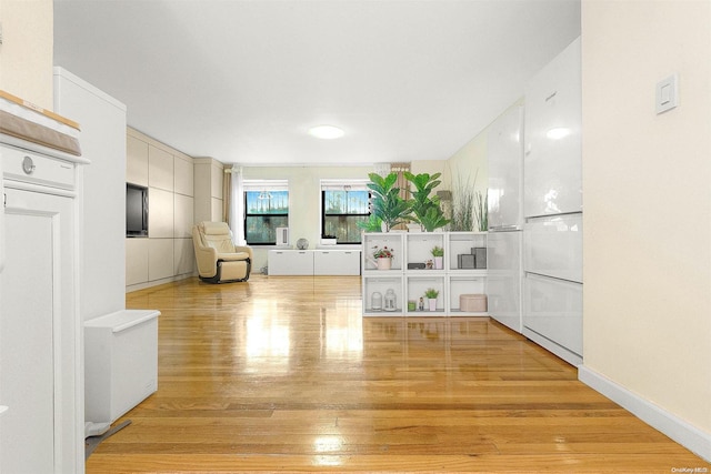 unfurnished living room featuring light hardwood / wood-style floors