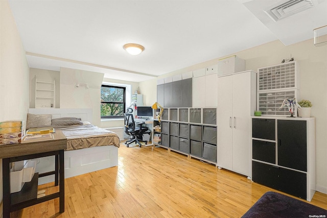 bedroom with light hardwood / wood-style flooring