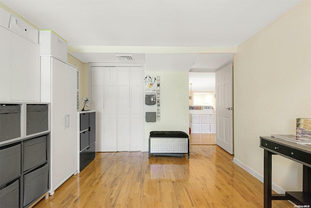 kitchen featuring white cabinets and light hardwood / wood-style floors