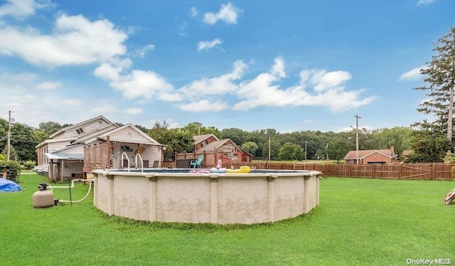 view of pool featuring a yard