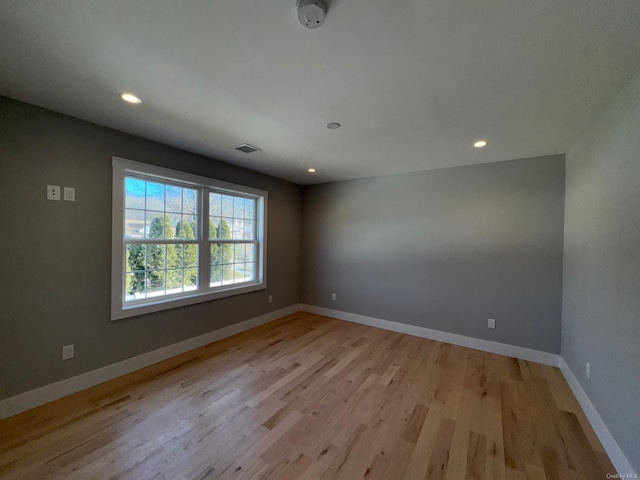 unfurnished room featuring light hardwood / wood-style flooring