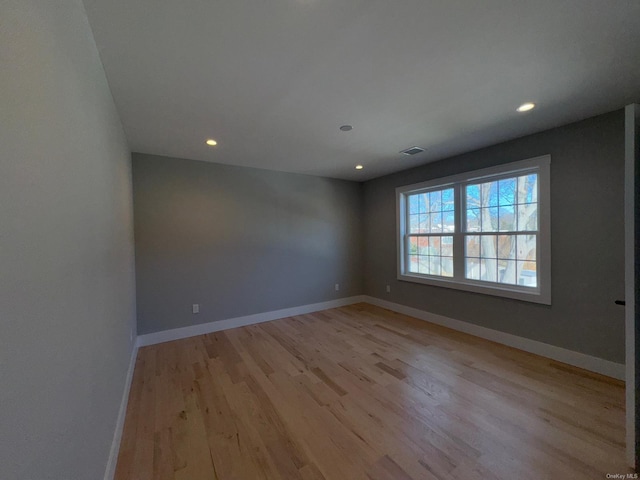 unfurnished room featuring light hardwood / wood-style floors