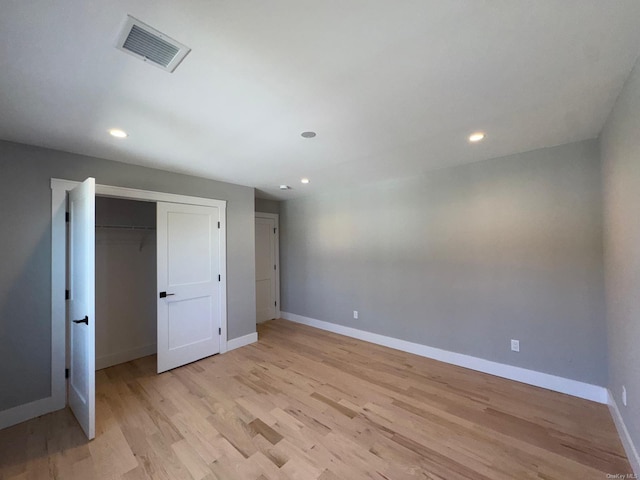 interior space featuring light wood-type flooring and a closet