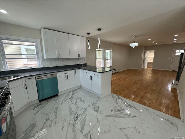 kitchen featuring stainless steel appliances, kitchen peninsula, pendant lighting, light hardwood / wood-style floors, and white cabinets