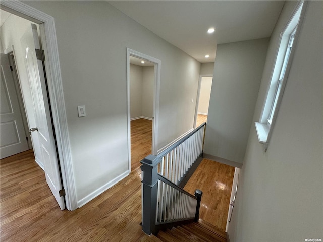 stairway with hardwood / wood-style flooring