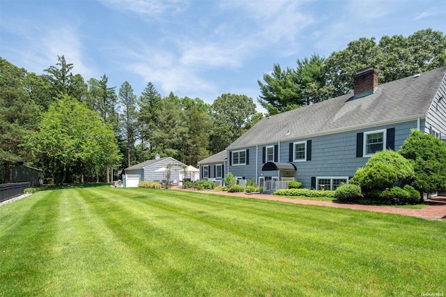 view of yard with an outdoor structure and a garage