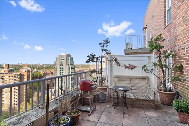 balcony featuring area for grilling