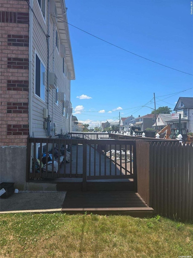 view of gate with a deck