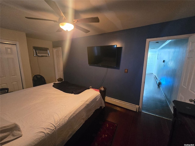 bedroom featuring baseboard heating, ceiling fan, dark hardwood / wood-style floors, and an AC wall unit