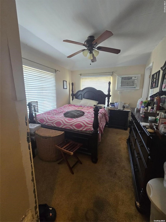 carpeted bedroom featuring a wall mounted air conditioner and ceiling fan