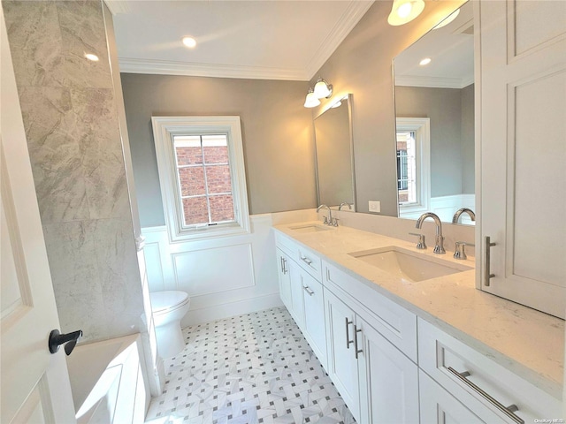 bathroom featuring vanity, toilet, and ornamental molding