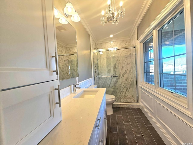 bathroom with walk in shower, crown molding, a chandelier, toilet, and vanity