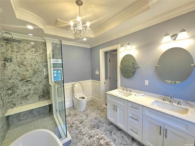 bathroom featuring vanity, a shower with door, an inviting chandelier, and ornamental molding