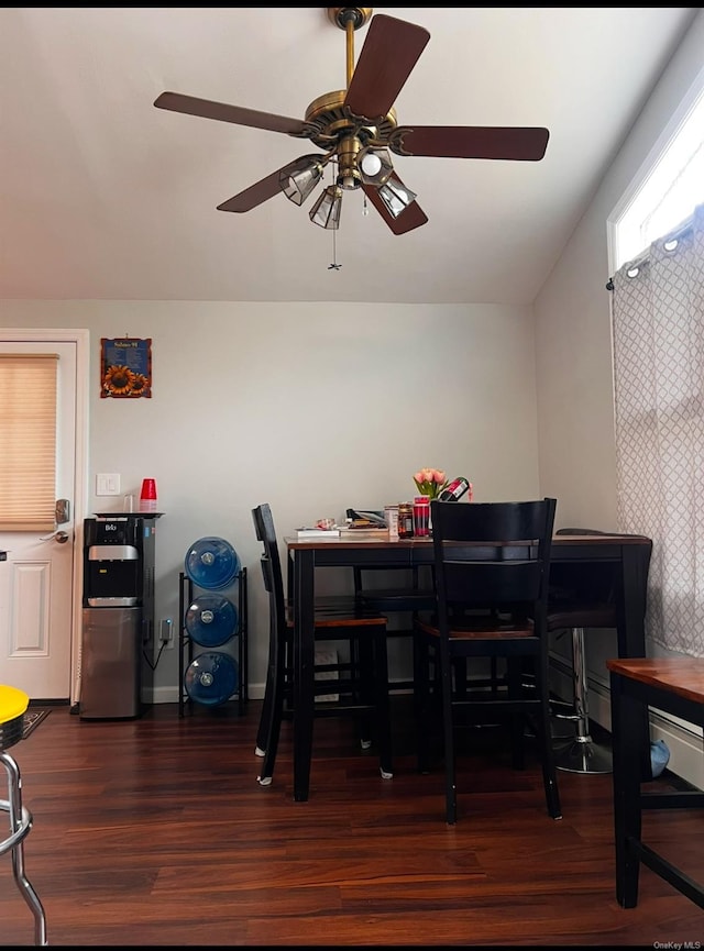 dining area featuring ceiling fan and dark wood-type flooring