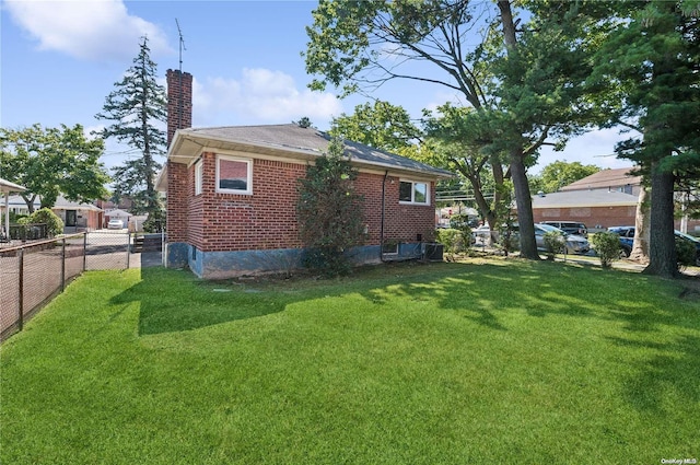 back of house featuring a yard