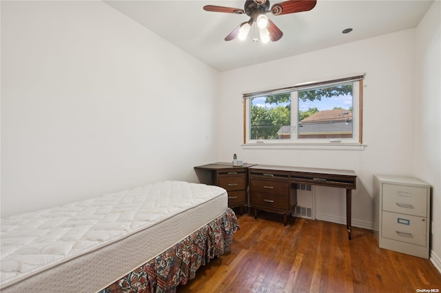 bedroom featuring ceiling fan and dark hardwood / wood-style flooring