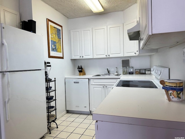 kitchen featuring white appliances, exhaust hood, sink, a textured ceiling, and white cabinetry