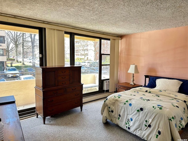 carpeted bedroom featuring a textured ceiling