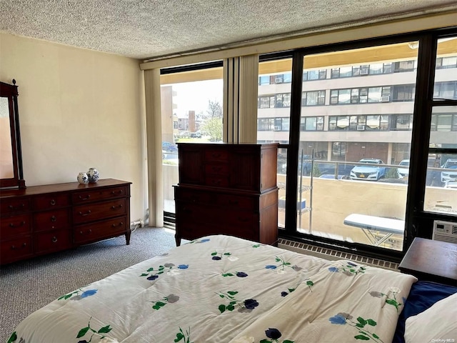 bedroom featuring light colored carpet and a textured ceiling