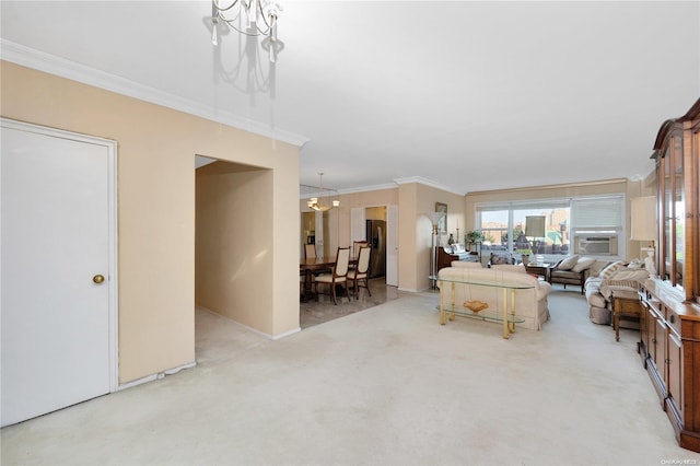 living room with light colored carpet, an inviting chandelier, cooling unit, and ornamental molding