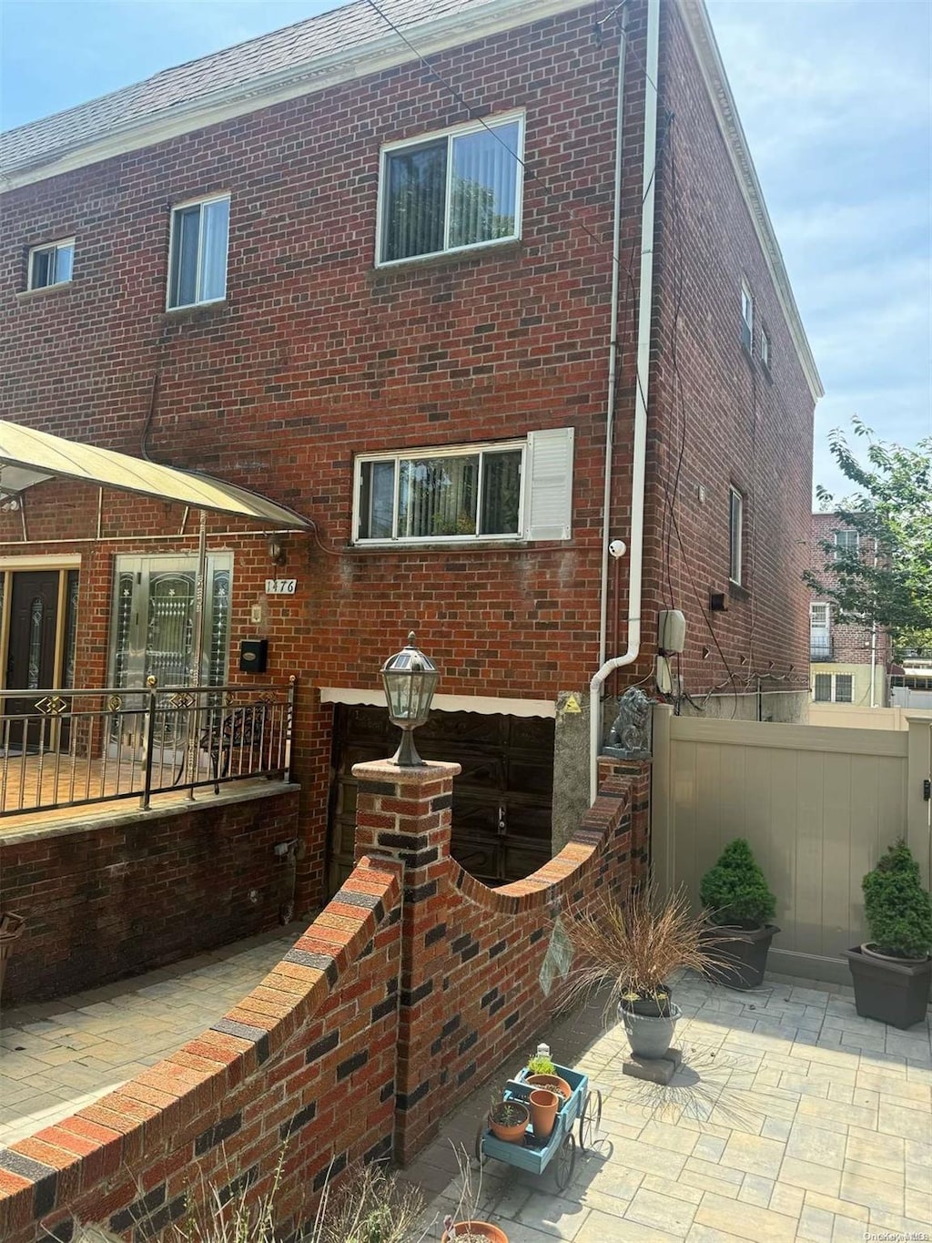 rear view of property featuring a patio area