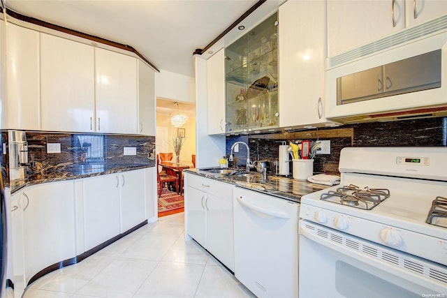 kitchen with sink, light tile patterned floors, white appliances, decorative backsplash, and white cabinets