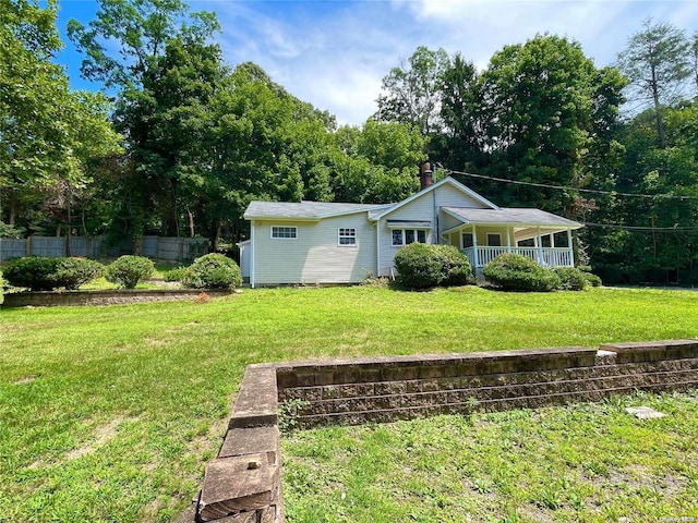 view of front of house with a front lawn and covered porch