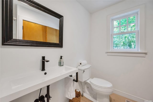 bathroom with toilet and sink