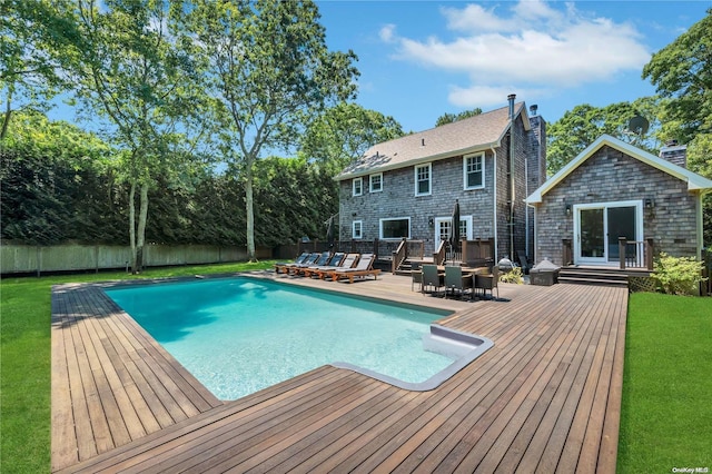 view of pool with a wooden deck