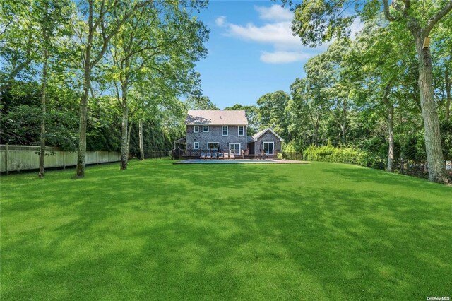 view of yard with a wooden deck