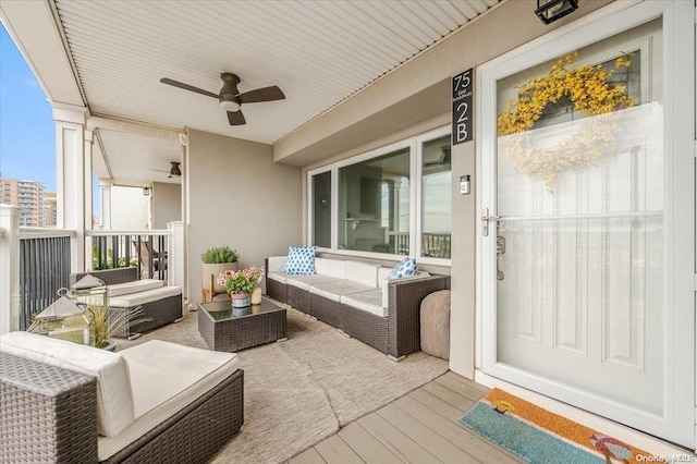 exterior space featuring an outdoor living space and ceiling fan