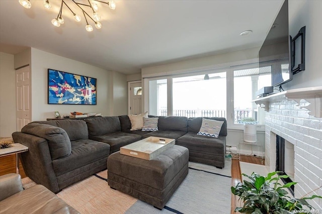 living room featuring a brick fireplace