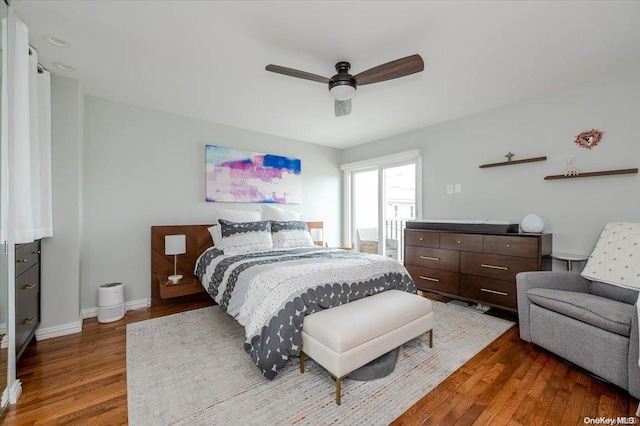 bedroom featuring ceiling fan and dark hardwood / wood-style flooring