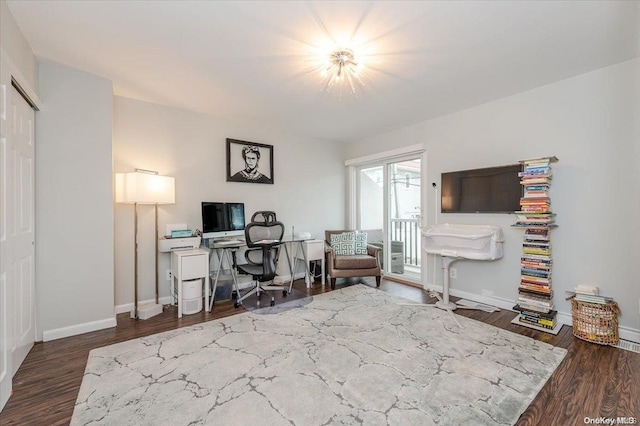 office with dark hardwood / wood-style floors