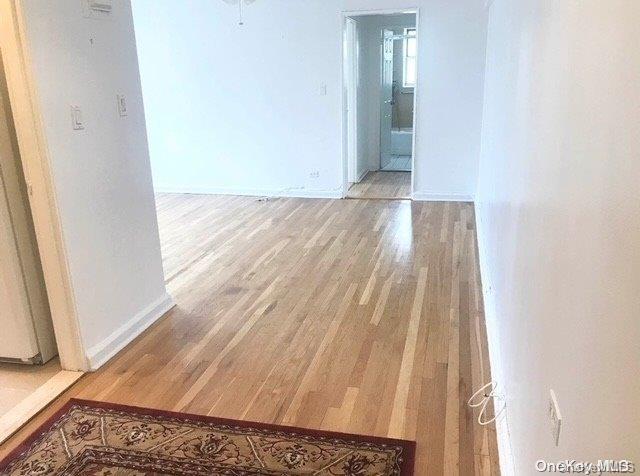 empty room featuring hardwood / wood-style flooring