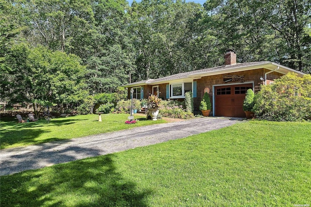 ranch-style home with a front yard and a garage