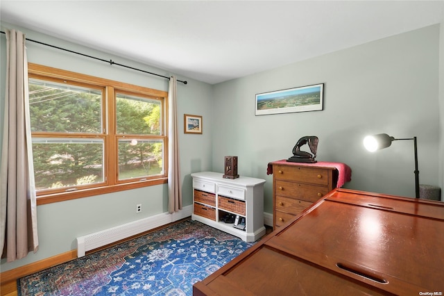 office area featuring hardwood / wood-style floors and a baseboard radiator