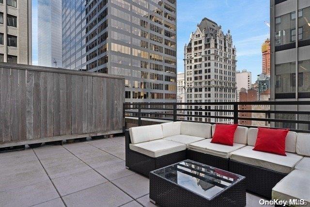 view of patio featuring an outdoor hangout area and a balcony