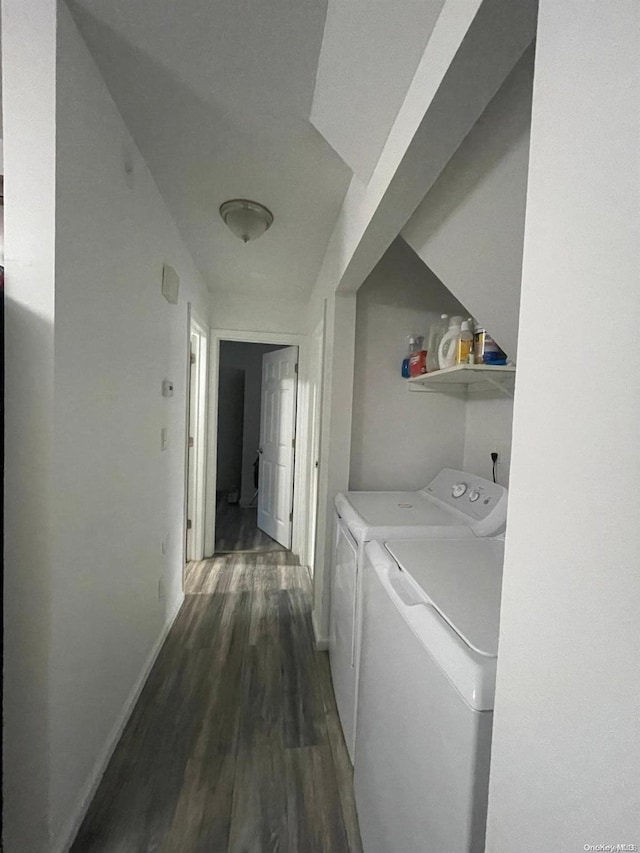 washroom featuring washing machine and dryer and dark hardwood / wood-style floors