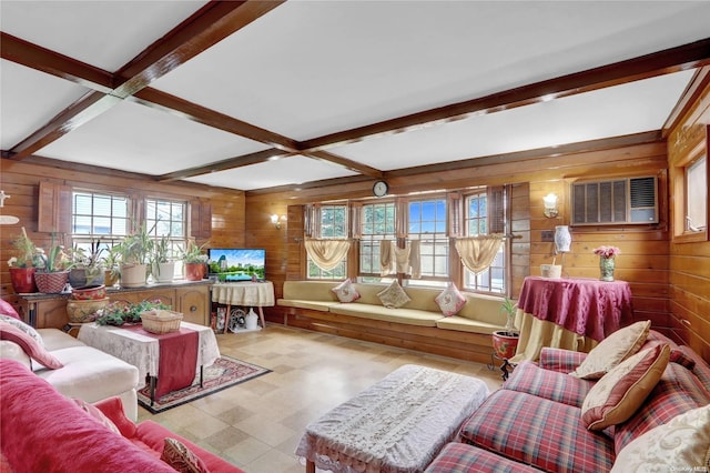 living room with beamed ceiling and wooden walls