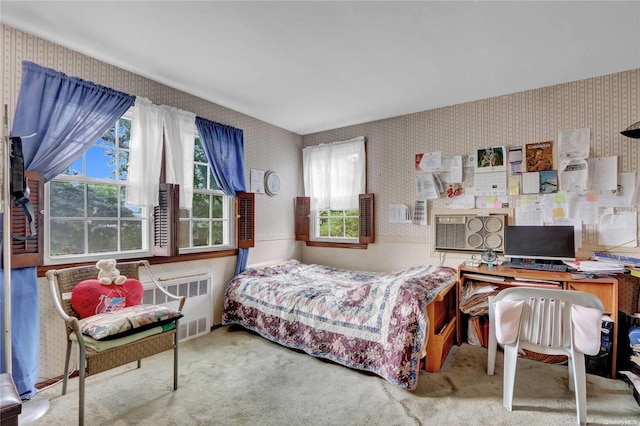 carpeted bedroom featuring radiator heating unit