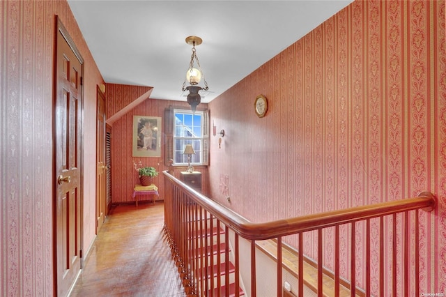 corridor with a chandelier