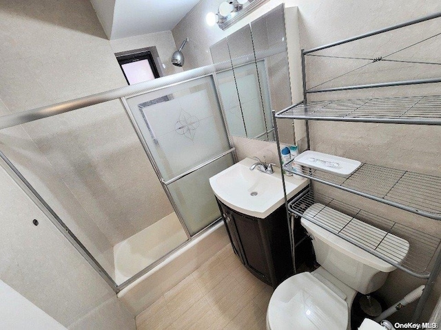 bathroom with vanity, toilet, and walk in shower