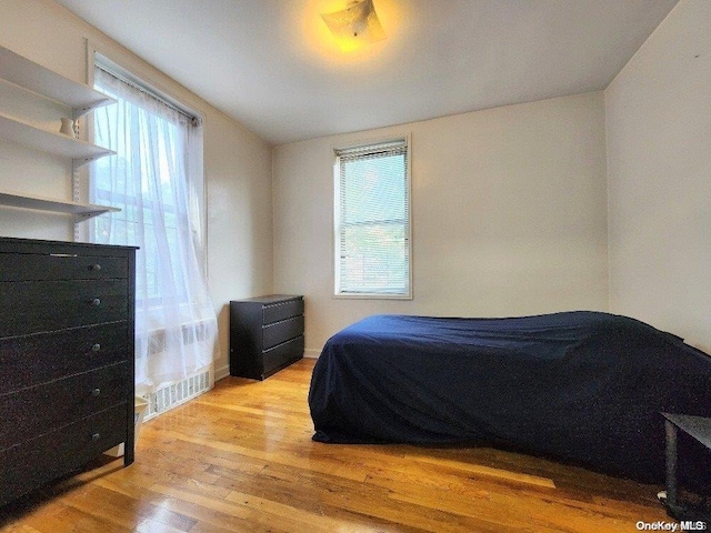 bedroom with light hardwood / wood-style flooring