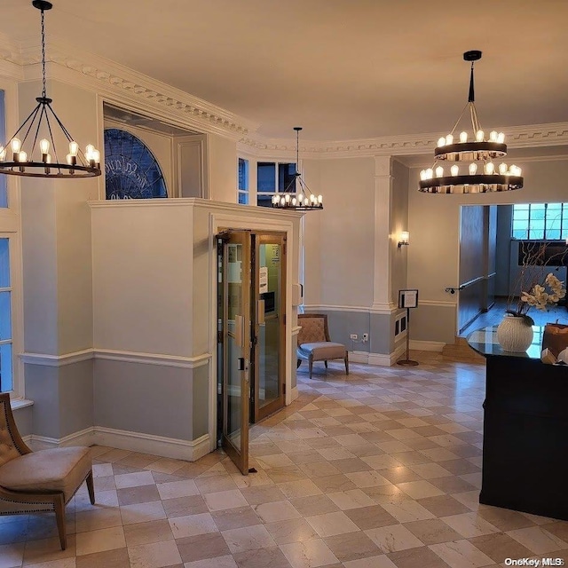 dining area featuring baseboards, a notable chandelier, and ornamental molding