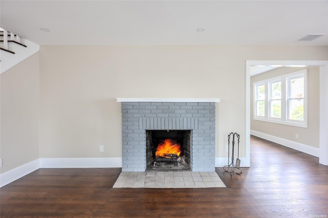 room details with hardwood / wood-style flooring and a brick fireplace